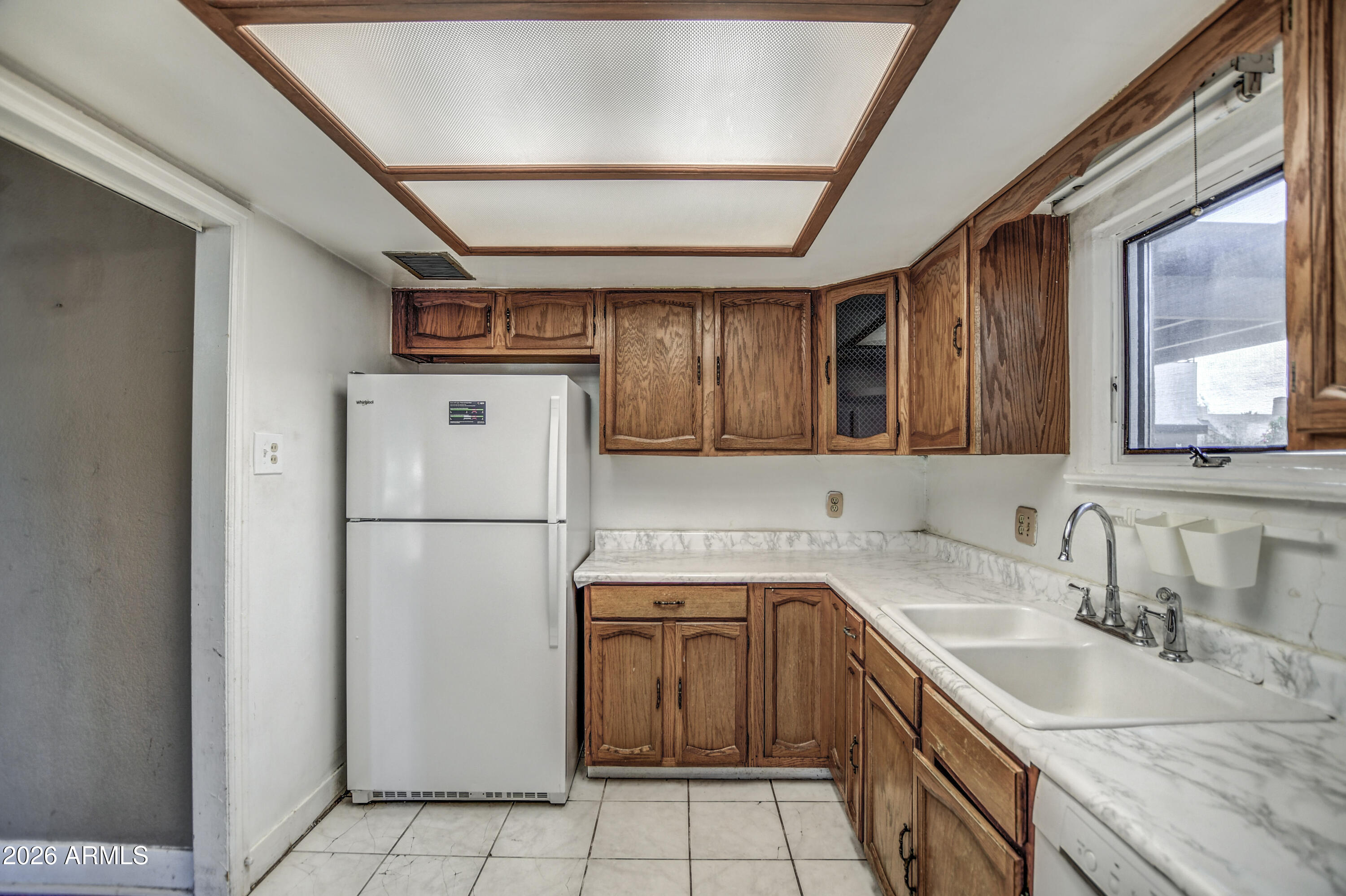 384 East Windsor Avenue Phoenix, AZ 85004 - Photo 29 of 42 a kitchen with a sink a refrigerator and a sink