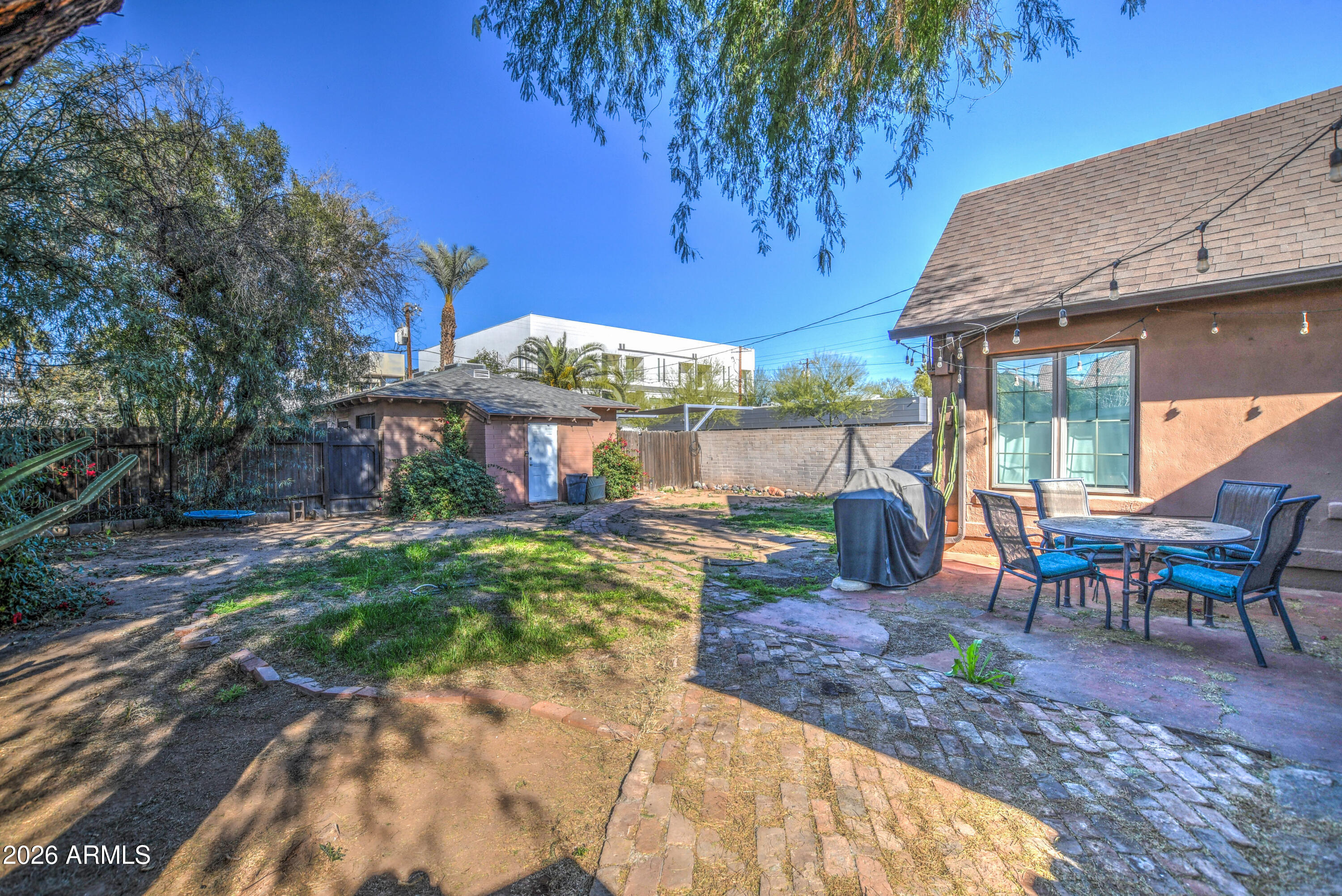 384 East Windsor Avenue Phoenix, AZ 85004 - Photo 36 of 42 a view of a house with backyard porch and sitting area