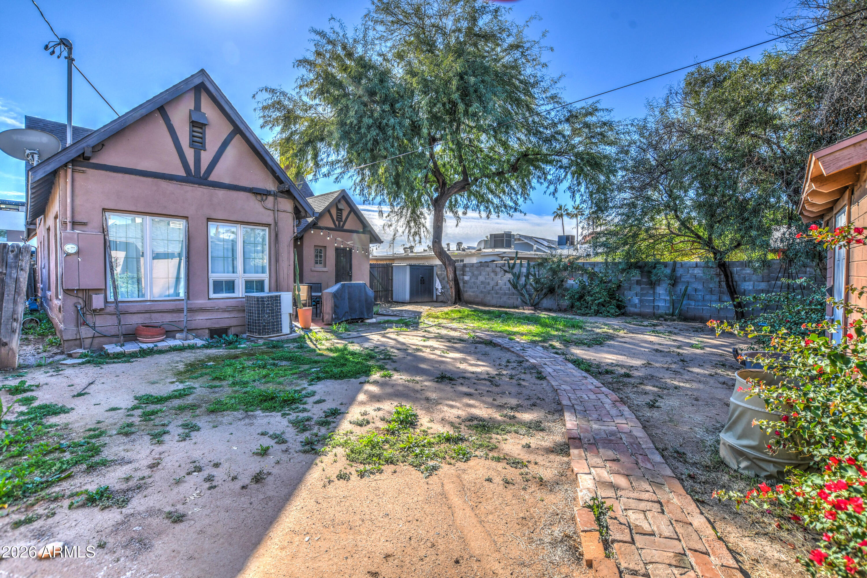 384 East Windsor Avenue Phoenix, AZ 85004 - Photo 38 of 42 a front view of a house with a yard and shrubs