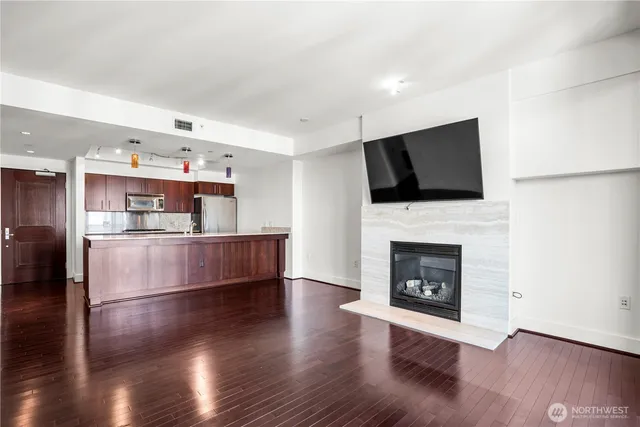 a living room with furniture and a fireplace