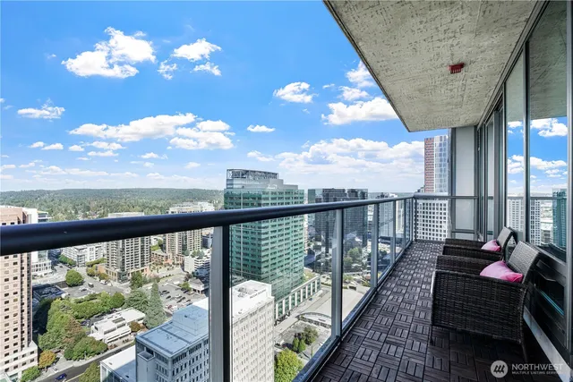 a view of a balcony with wooden floor