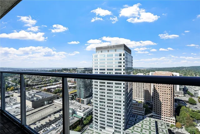 a view of a balcony with an outdoor seating