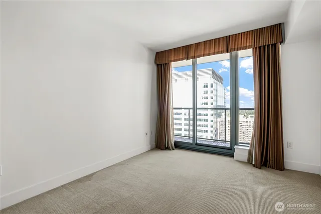 a view of an empty room with a large window