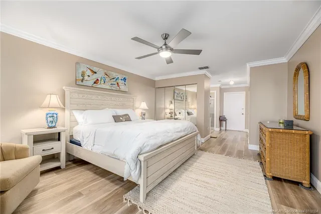 a large white bathroom with a sink mirror and a bath tub