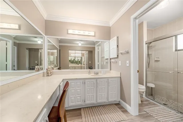 a spacious bathroom with a double vanity sink and a mirror
