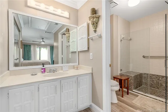 a bedroom with two beds and a chandelier