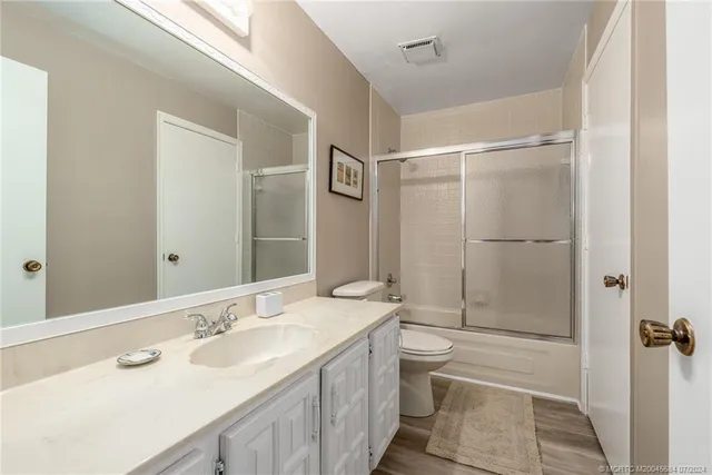a kitchen with stainless steel appliances a refrigerator and a stove