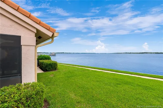 an aerial view of a house with a lake view
