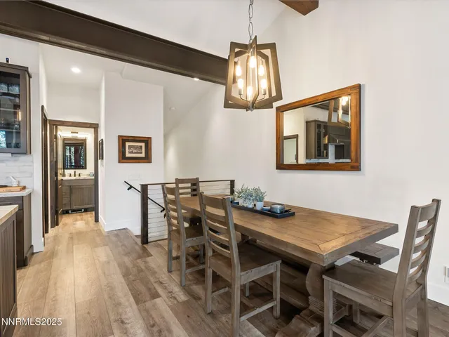 a bedroom with a large bed and a flat screen tv