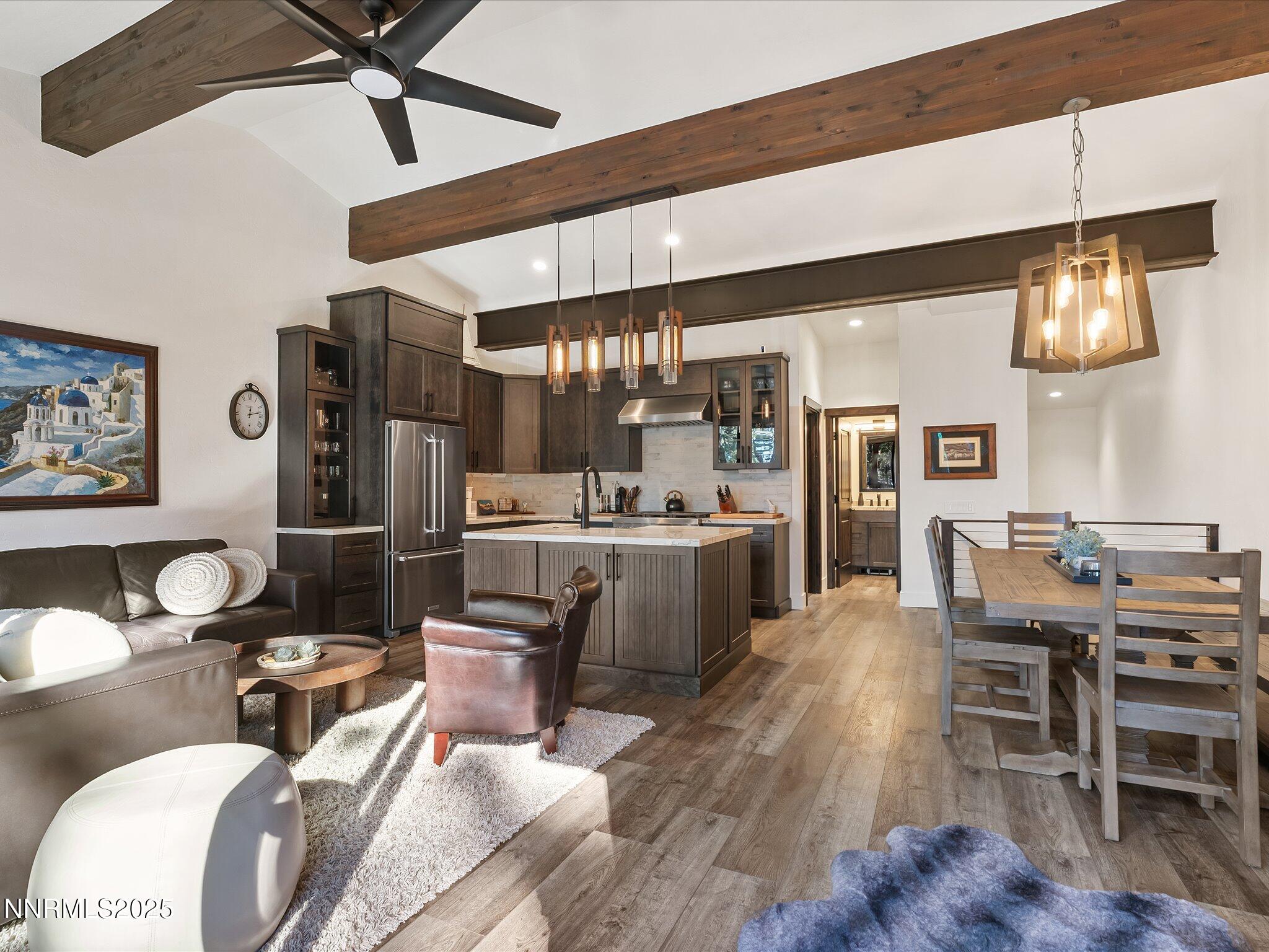 600 Highway 50, Unit 60 Zephyr Cove, NV 89448 - Photo 17 of 59 a living room with lots of wooden furniture and a ceiling fan