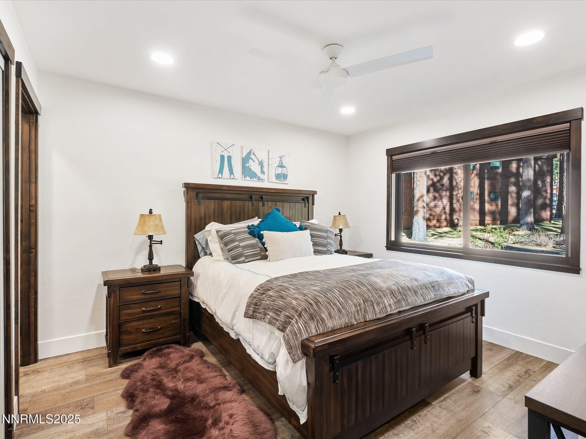 600 Highway 50, Unit 60 Zephyr Cove, NV 89448 - Photo 19 of 59 a bedroom with a bed and a large window