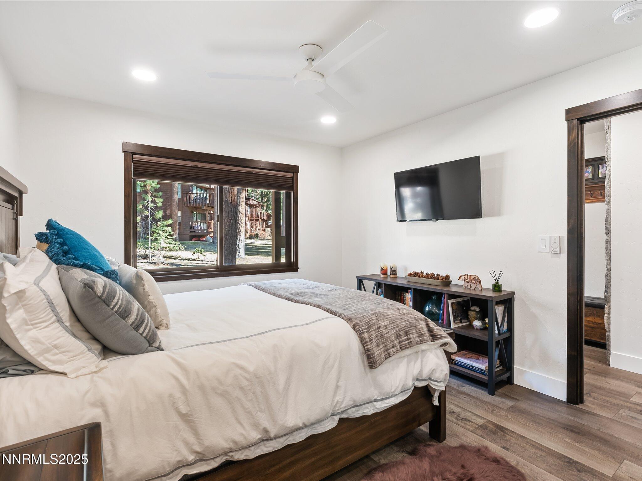 600 Highway 50, Unit 60 Zephyr Cove, NV 89448 - Photo 20 of 59 a bedroom with a large bed and a flat screen tv