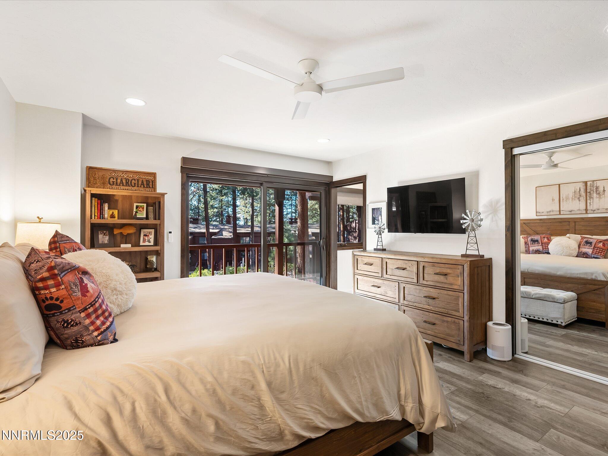 600 Highway 50, Unit 60 Zephyr Cove, NV 89448 - Photo 24 of 59 a bedroom with a large bed and a flat screen tv