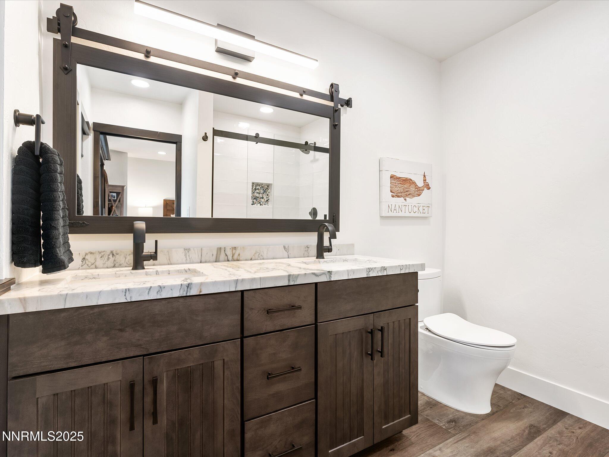 600 Highway 50, Unit 60 Zephyr Cove, NV 89448 - Photo 27 of 59 a bathroom with a toilet sink and mirror
