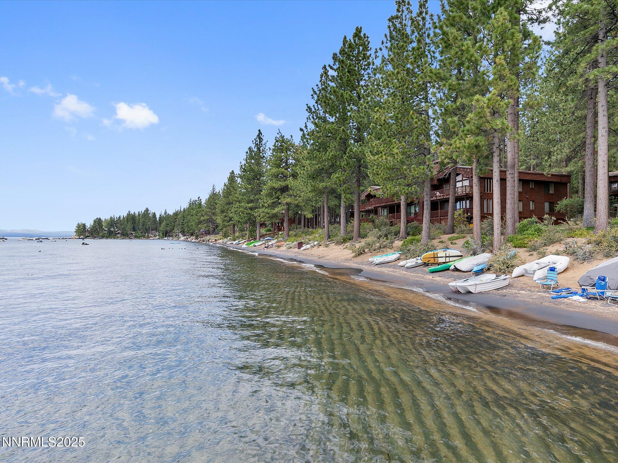 600 Highway 50, Unit 60 Zephyr Cove, NV 89448 - Photo 42 of 59 a view of a lake with a house in the background