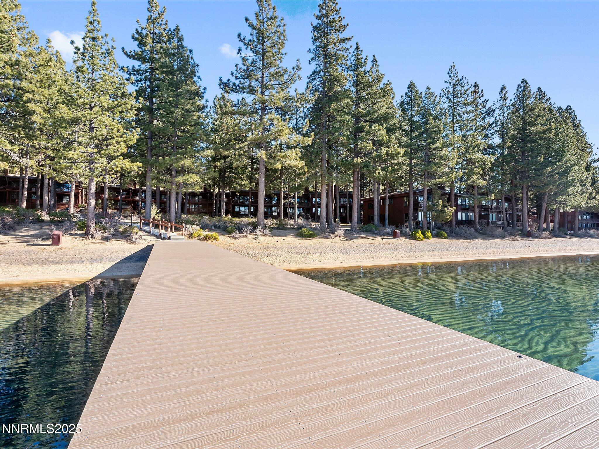 600 Highway 50, Unit 60 Zephyr Cove, NV 89448 - Photo 56 of 59 a swimming pool with trees in front of it