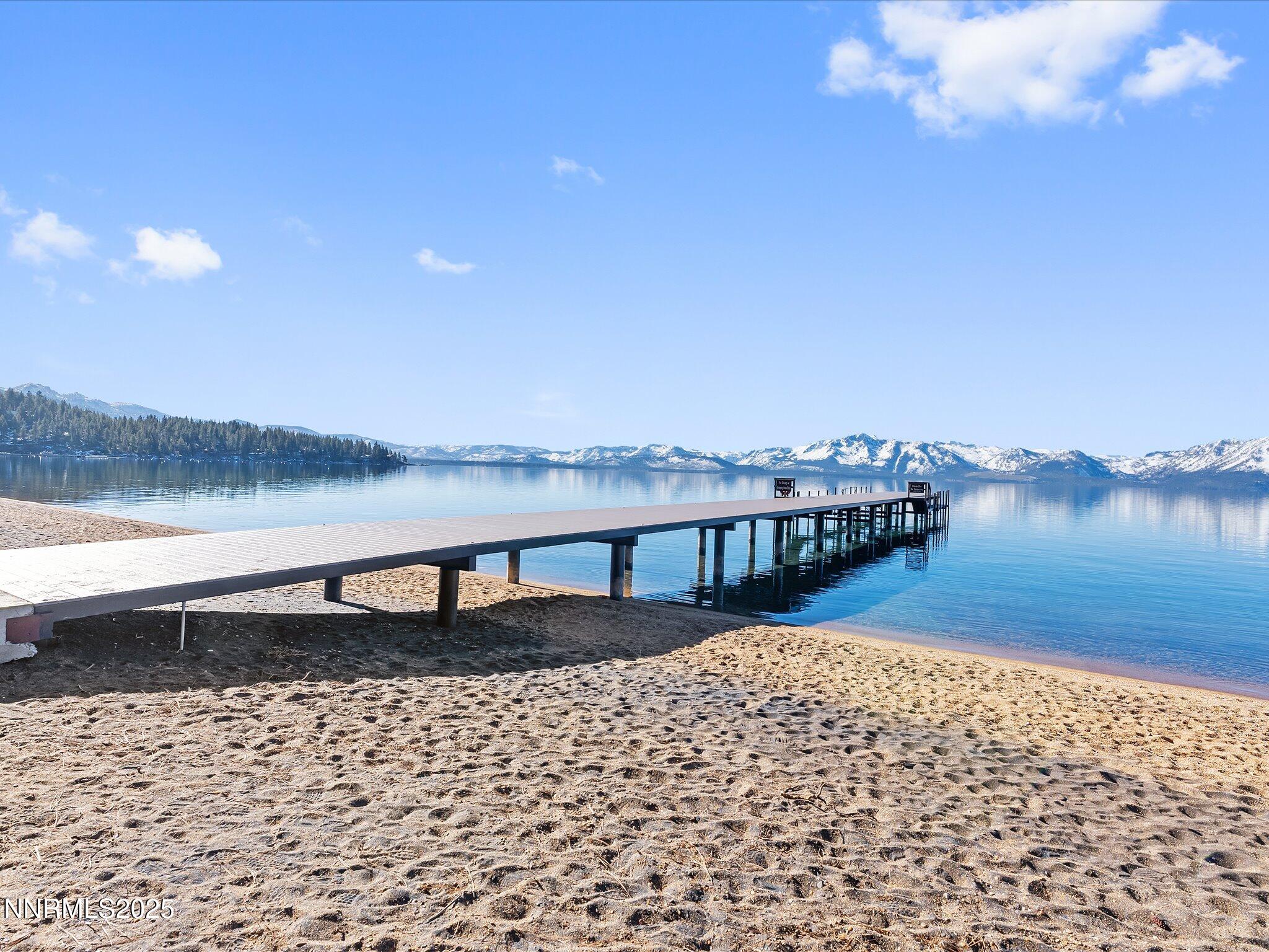 600 Highway 50, Unit 60 Zephyr Cove, NV 89448 - Photo 9 of 59 a view of a lake with houses in the background