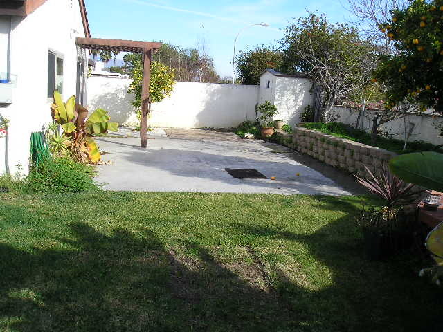 7337 Hillsboro Street Goleta, CA 93117 - Photo 13 of 18 a backyard of a house with lots of green space