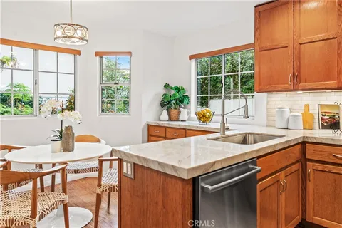 a kitchen with a sink and a window