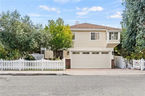 a front view of a house with a garage