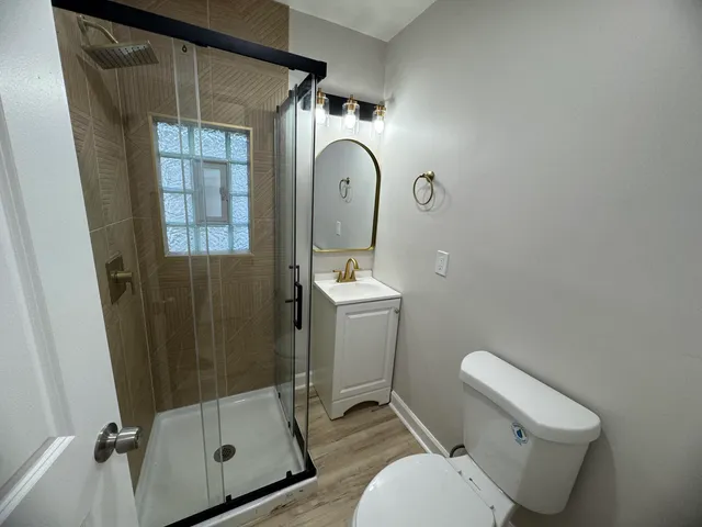 a bathroom with a toilet and a sink