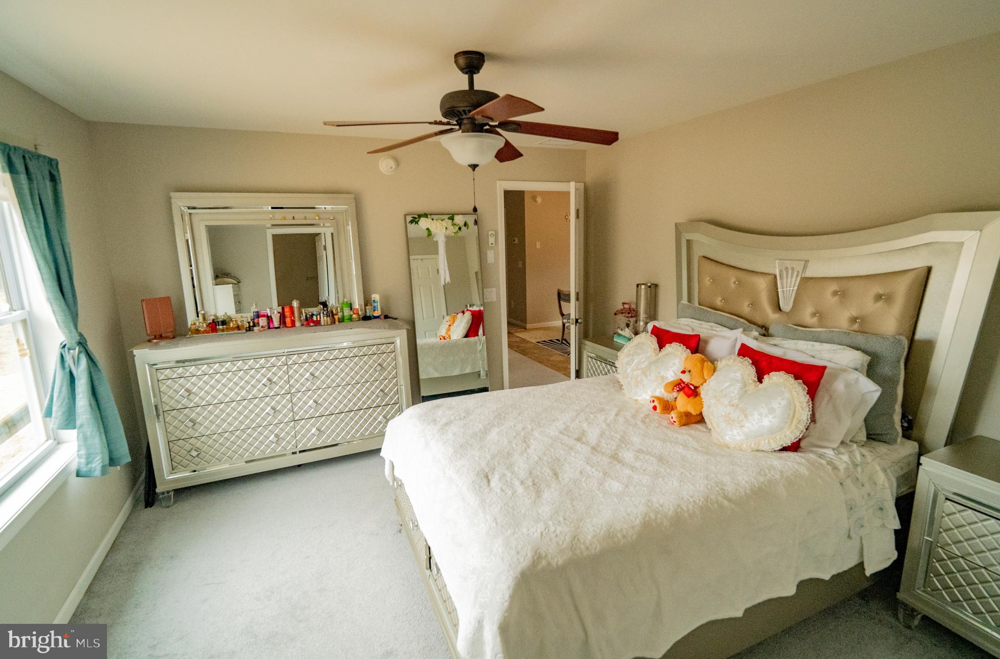 2905 Smith Point Road Nanjemoy, MD 20662 - Photo 13 of 32 a bedroom with a bed and a chandelier