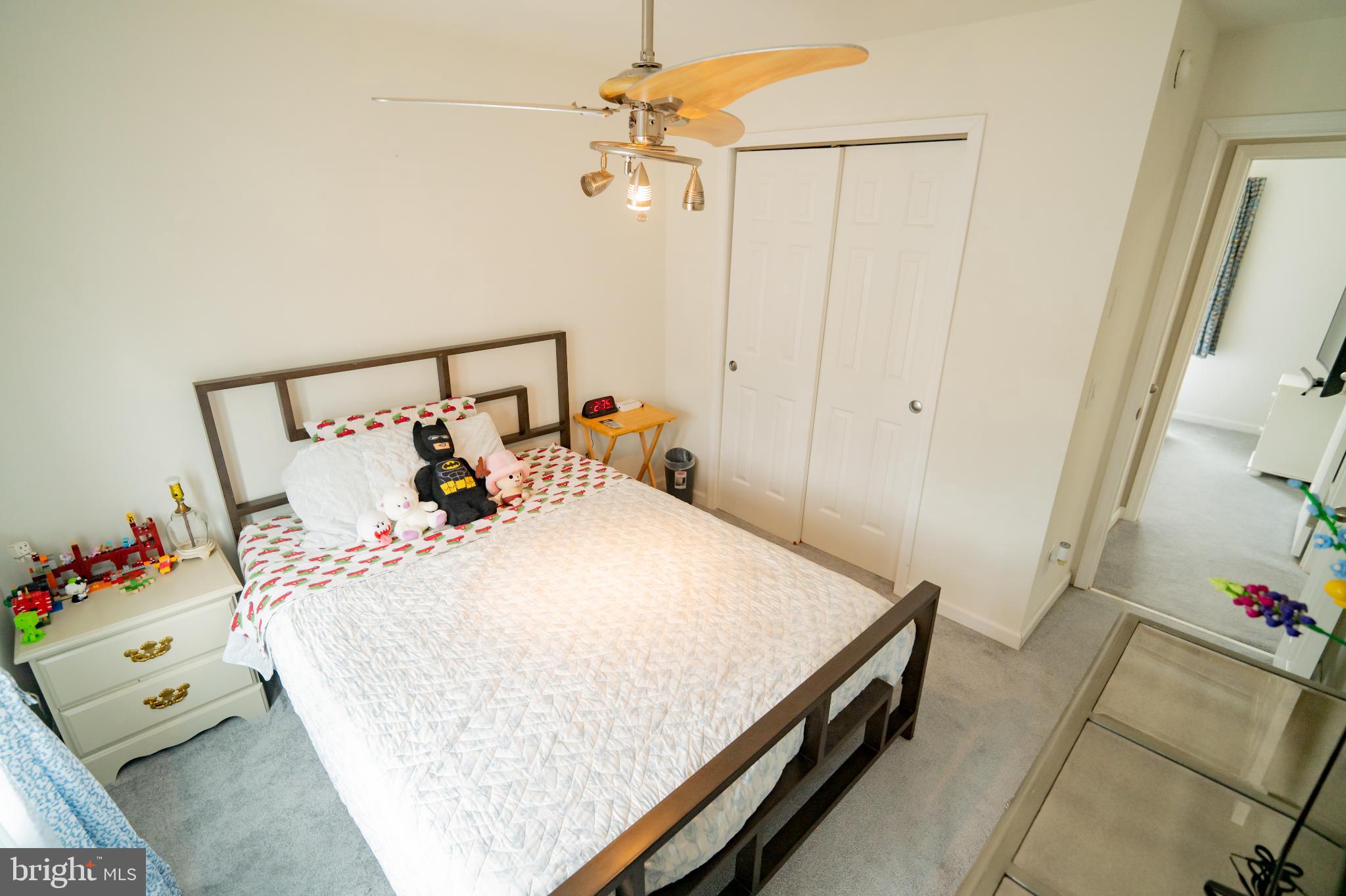 2905 Smith Point Road Nanjemoy, MD 20662 - Photo 16 of 32 a bed room with a bed and a potted plant