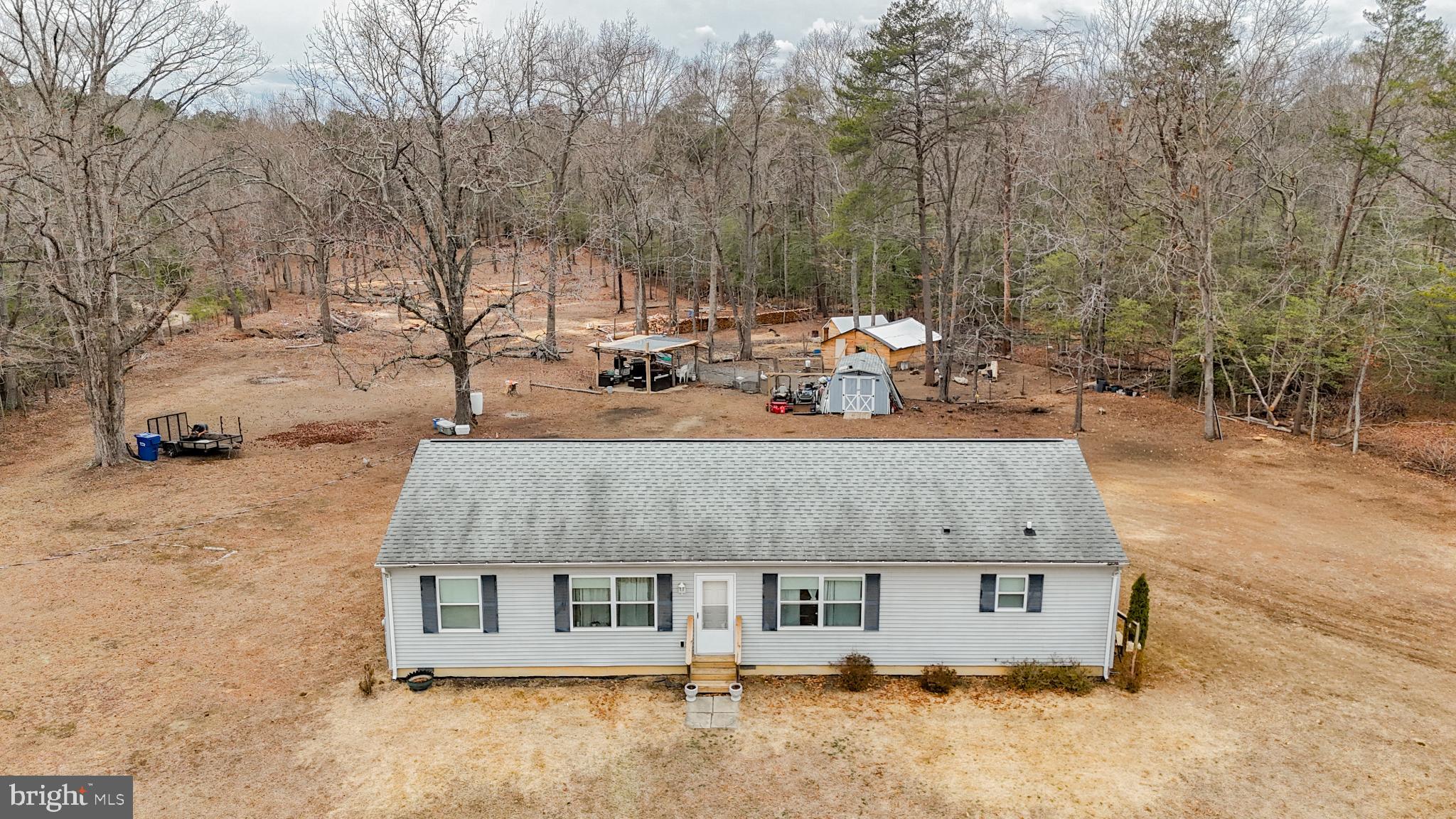 2905 Smith Point Road Nanjemoy, MD 20662 - Photo 3 of 32 an aerial view of a house with yard and trees