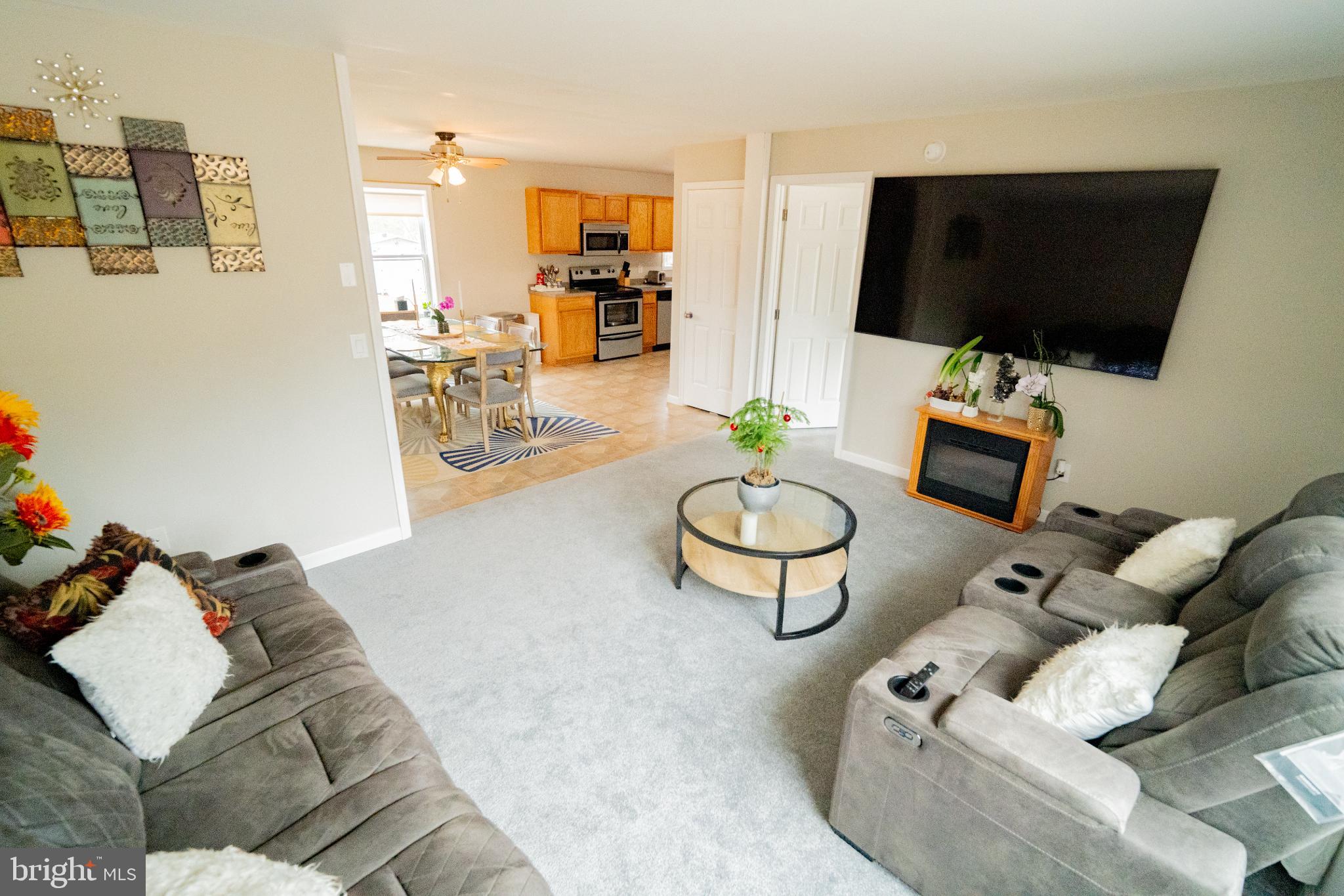 2905 Smith Point Road Nanjemoy, MD 20662 - Photo 6 of 32 a living room with furniture and a flat screen tv