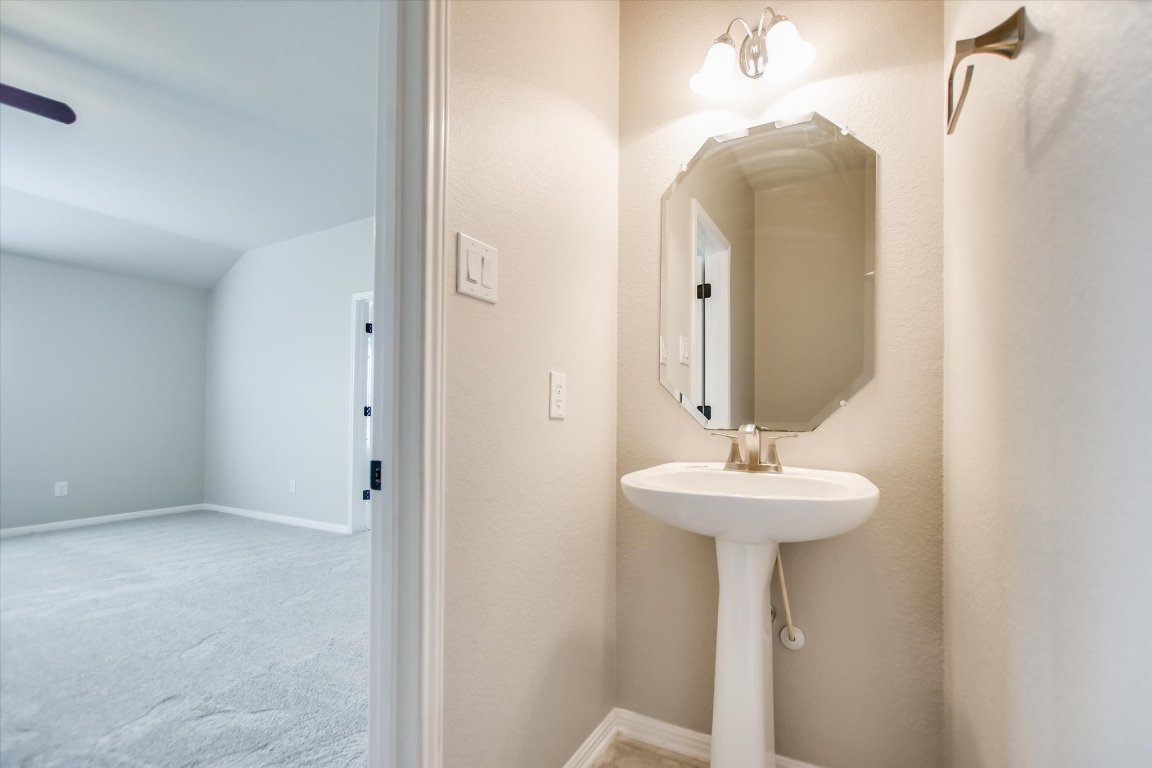 20105 Farm Pond Lane Pflugerville, TX 78660 - Photo 24 of 34 Convenient upstairs half bath for game room and media room.