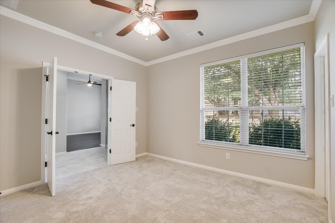 20105 Farm Pond Lane Pflugerville, TX 78660 - Photo 10 of 34 Front bedroom with walk-in closet, office or flex space.