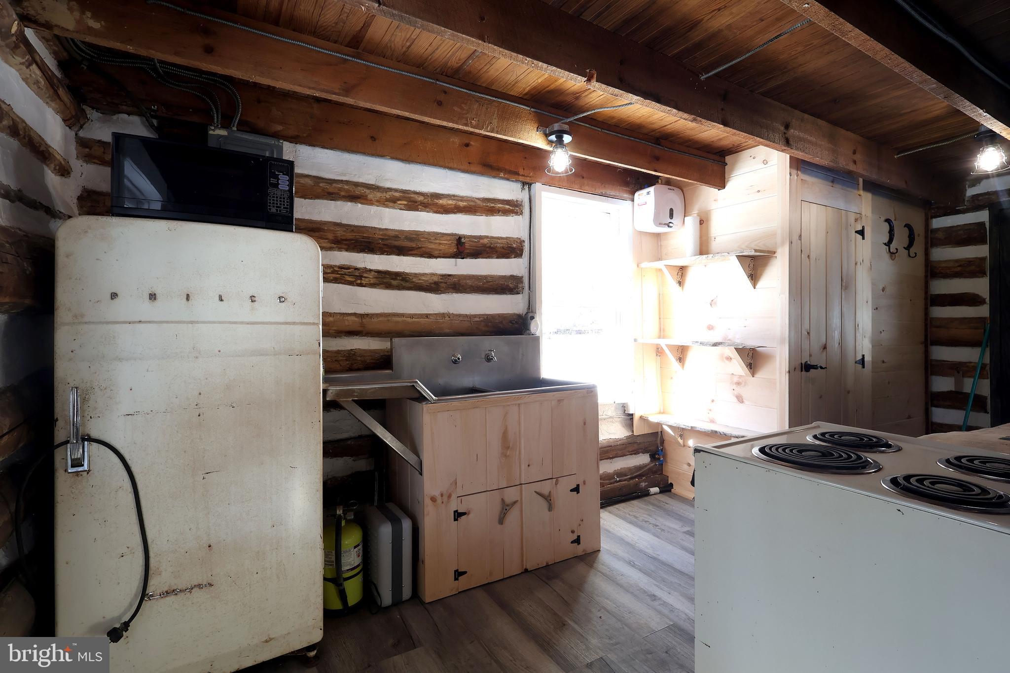 4464 Tram Road Spruce Creek, PA 16683 - Photo 23 of 53 a room with storage and utility