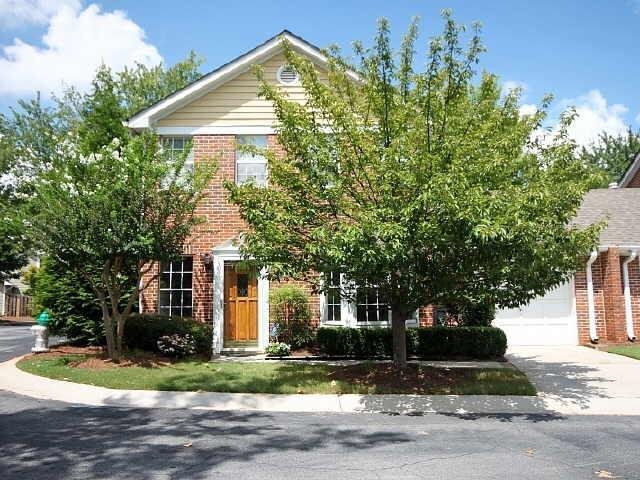 119 Mary Gay Court Decatur, GA 30030 - Photo 1 of 1 a front view of a house with a garden and trees