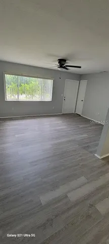 a view of an empty room with a window