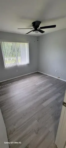 a view of an empty room with a window