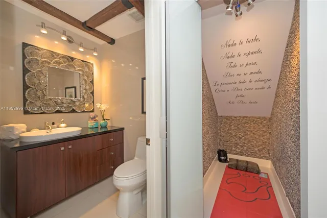 a living room with furniture and flat screen tv