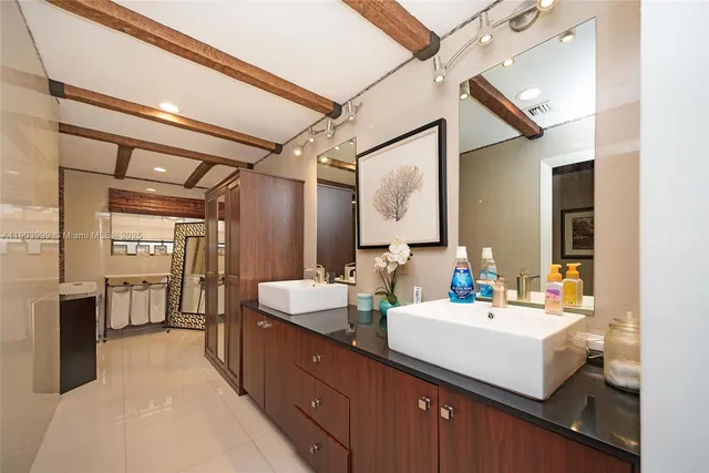 a bathroom with a shower and a sink