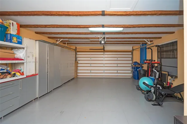 a kitchen with stainless steel appliances kitchen island granite countertop a stove and a sink