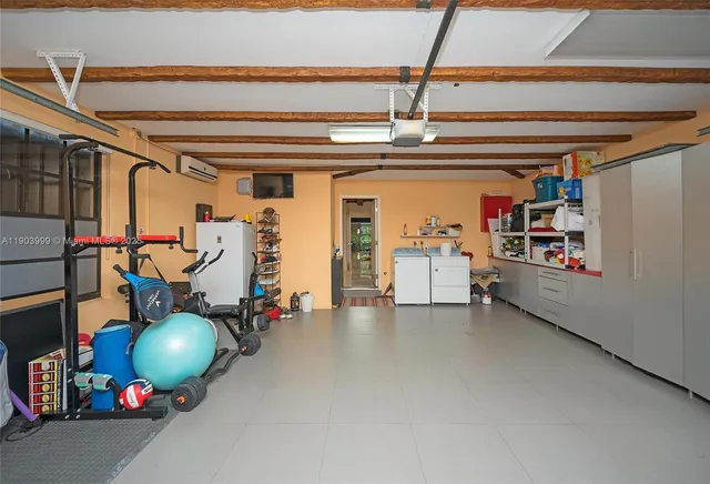 a kitchen with stainless steel appliances a sink and a refrigerator