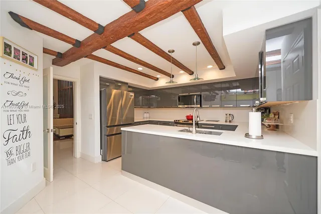 a spacious bathroom with a granite countertop sink and a mirror