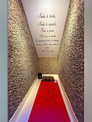 an aerial view of a city with lots of residential buildings ocean and mountain view in back