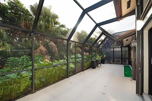 a view of a pathway of a building and tree