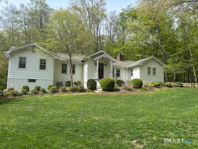 192 New Canaan Road Wilton, CT 06897 - Photo 1 of 9 a front view of house with yard and green space