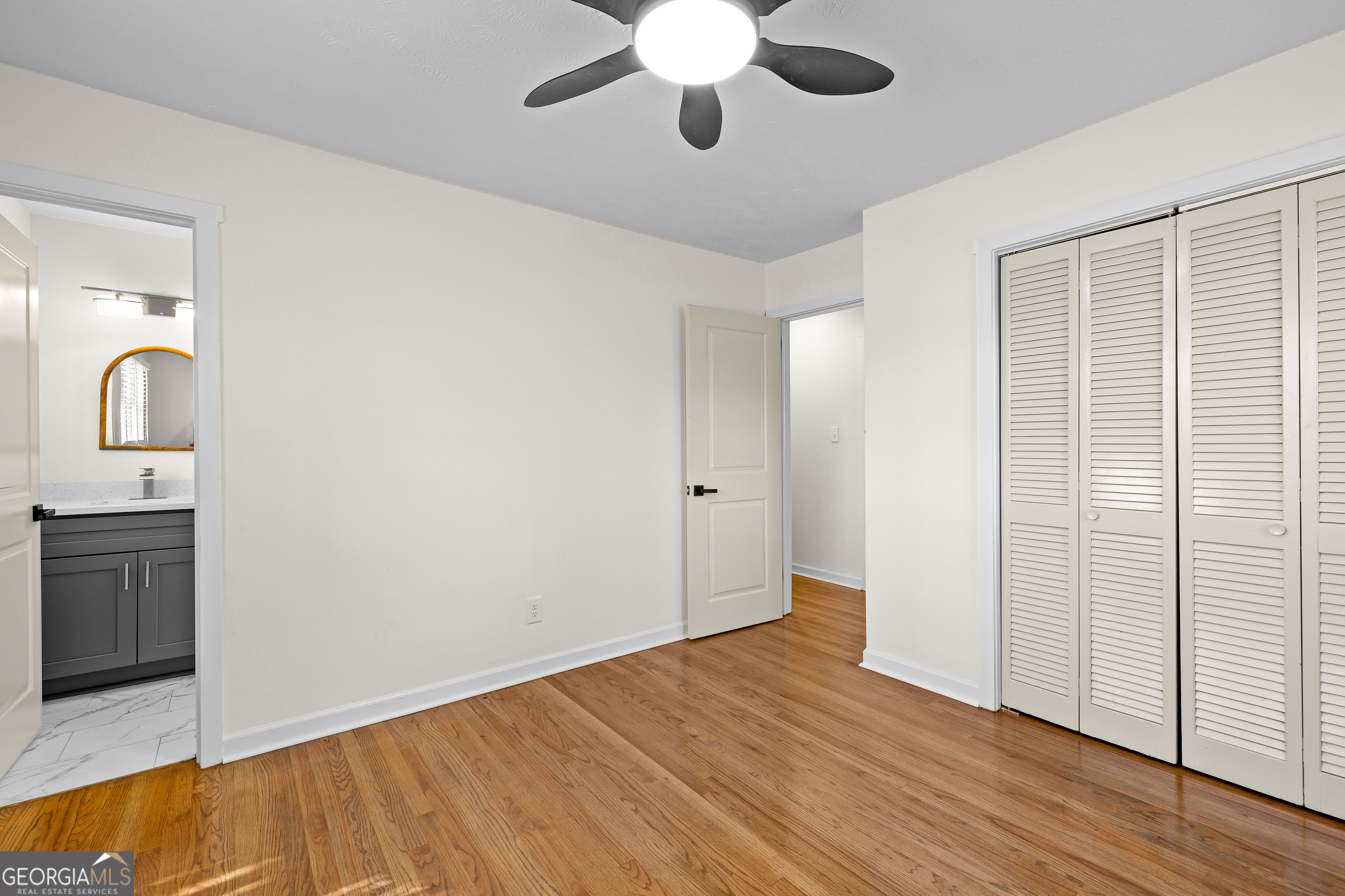 201 Smithstone Path Fayetteville, GA 30214 - Photo 27 of 57 wooden floor in an empty room with a window