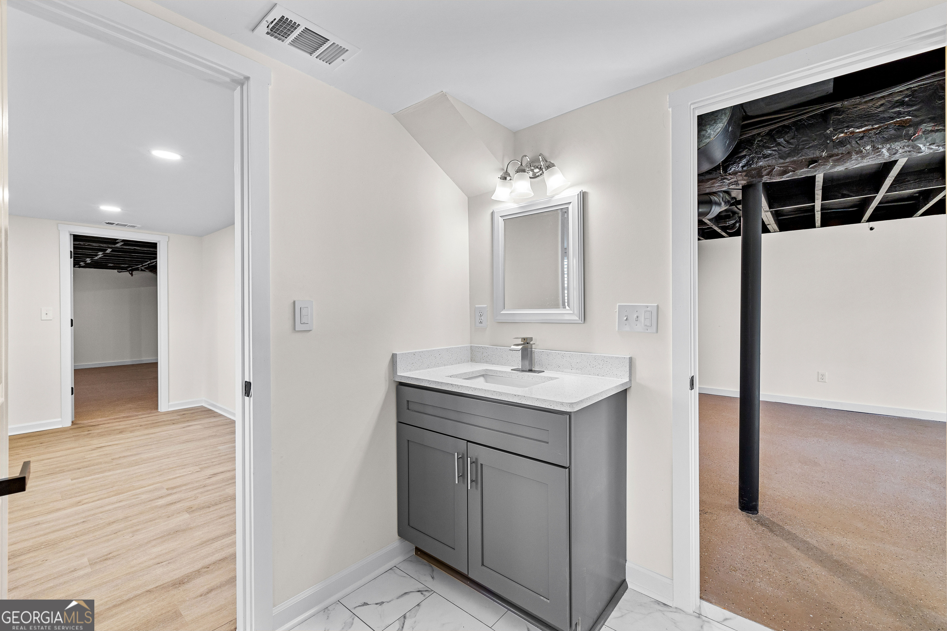 201 Smithstone Path Fayetteville, GA 30214 - Photo 39 of 57 a bathroom with a sink a toilet and shower