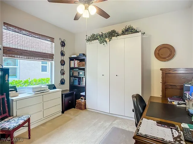 a workspace with furniture and window