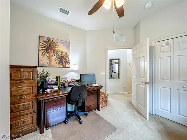 a view of a workspace with furniture