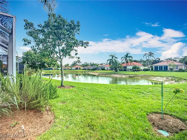 a view of a lake with a big yard