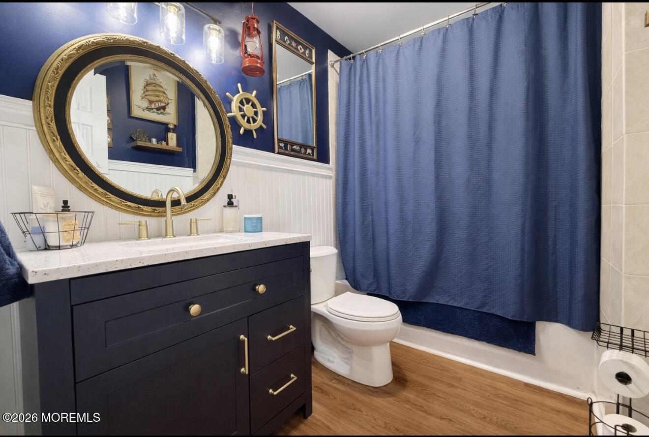 15 Commodore Court Barnegat, NJ 08005 - Photo 11 of 19 a bathroom with a sink a toilet and a mirror