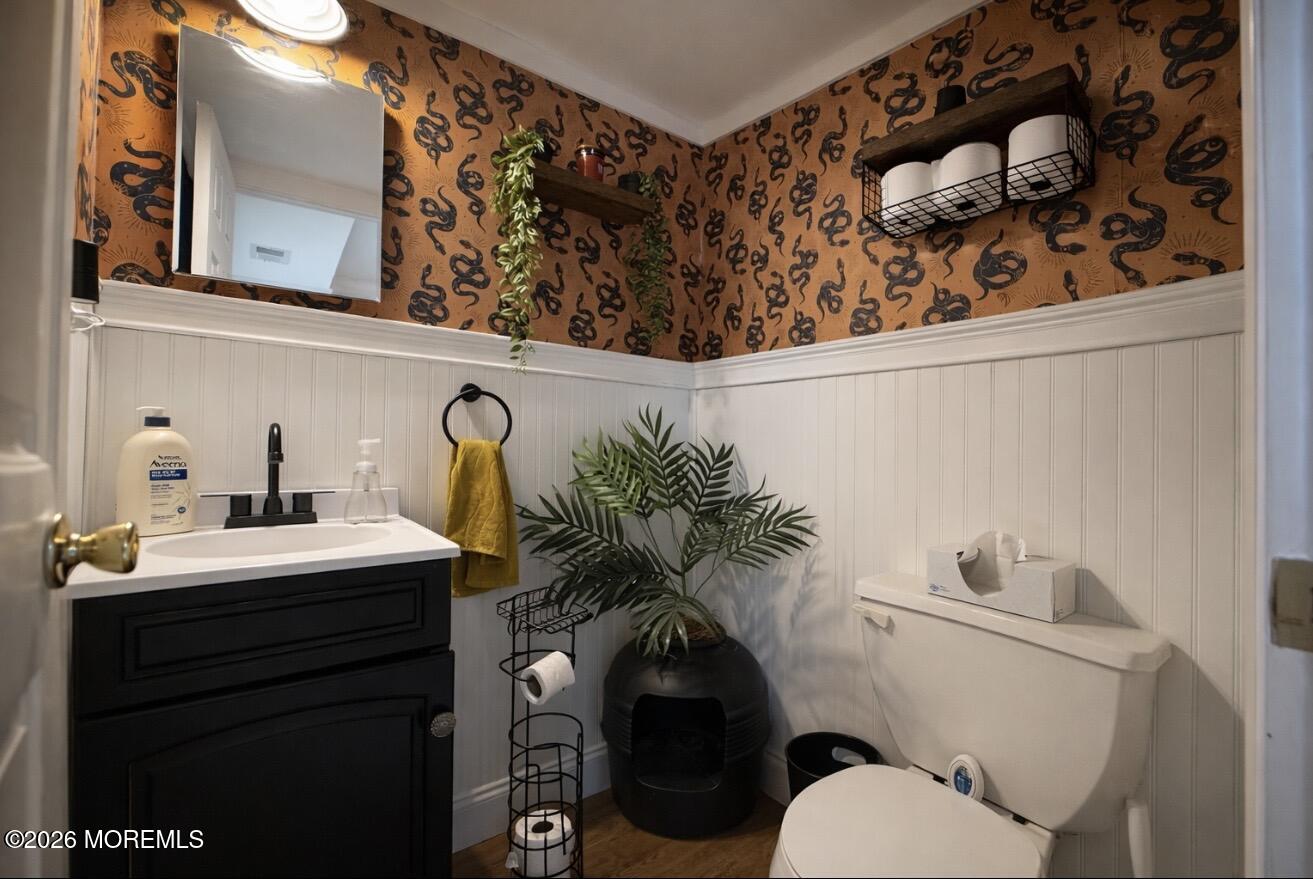 15 Commodore Court Barnegat, NJ 08005 - Photo 14 of 19 a bathroom with a toilet sink and mirror